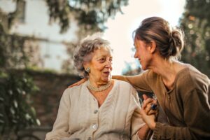 An elderly woman with a young woman